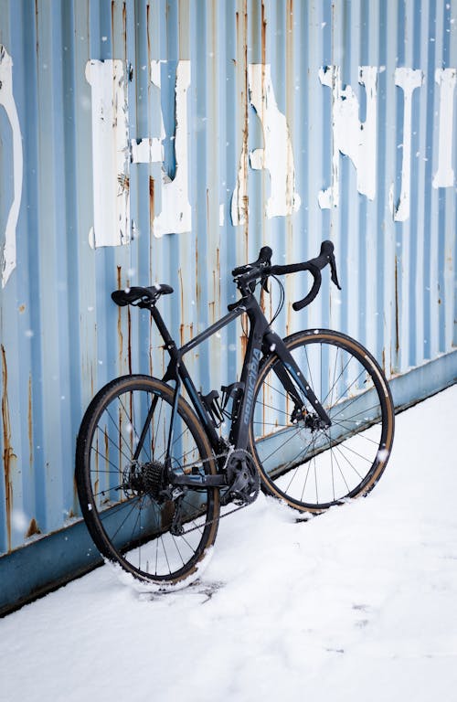 A Bicycle Parked Near the Cargo Container