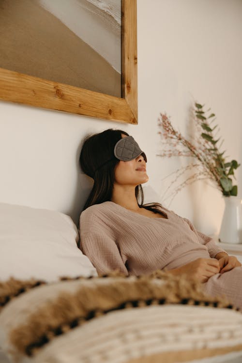 Free Woman Lying on the Bed Stock Photo