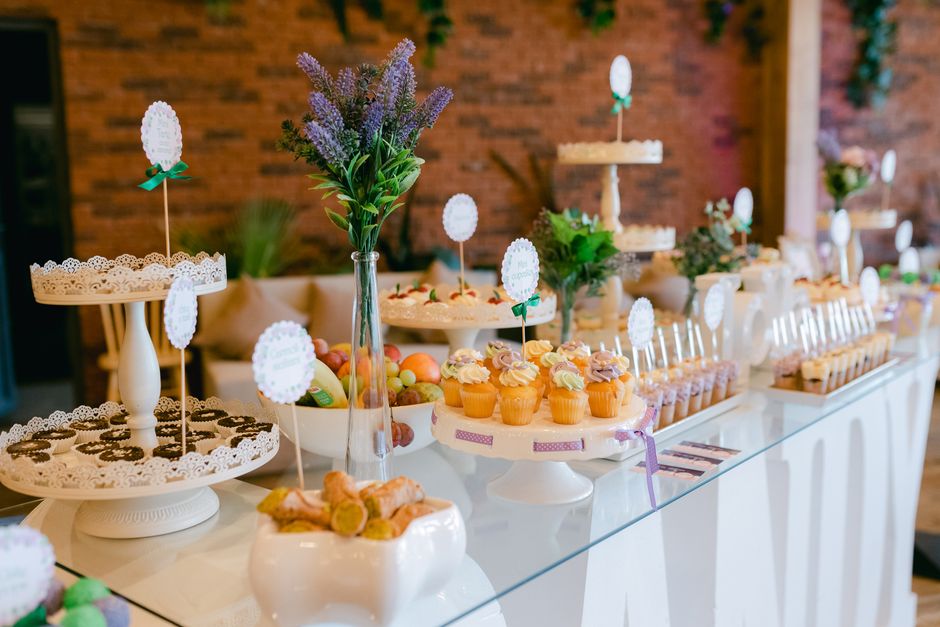 Elegant midnight snack bar setup at Indian wedding after-party with colorful food stations and fairy lights