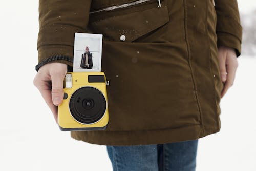 Person Holding an Instant Camera