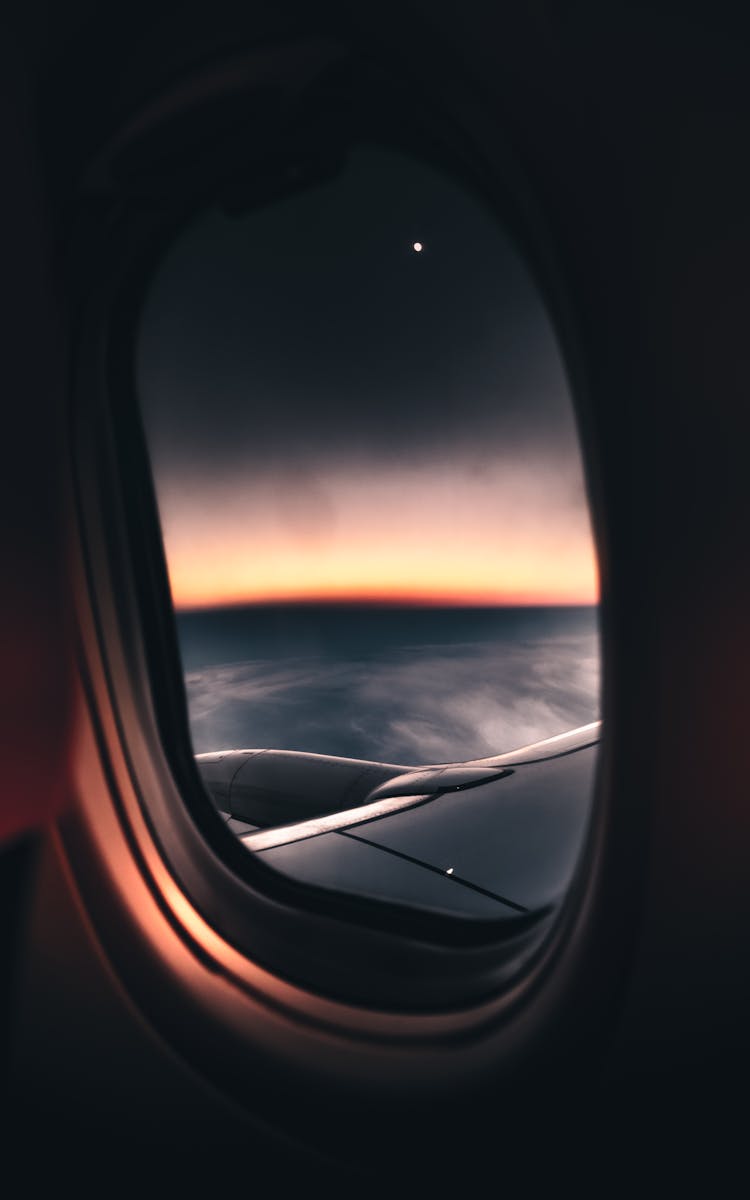 Airplane Window View During Sunset