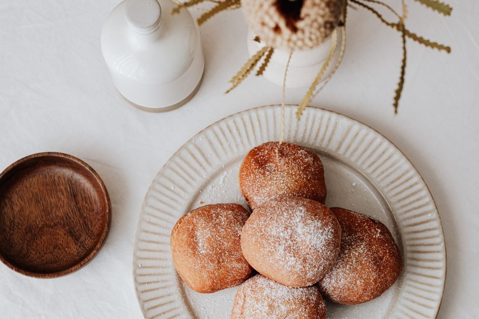 Rich, yeasted Polish doughnuts filled with fruit preserves, fried golden and dusted with powdered sugar.
