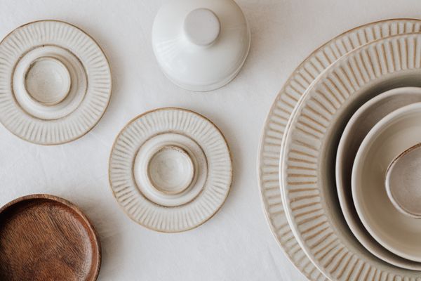 Neutral-toned ceramic plates by kaboompics.com on Pexels