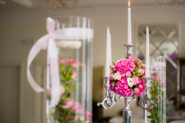 Candlelit floral centerpiece in blush tones