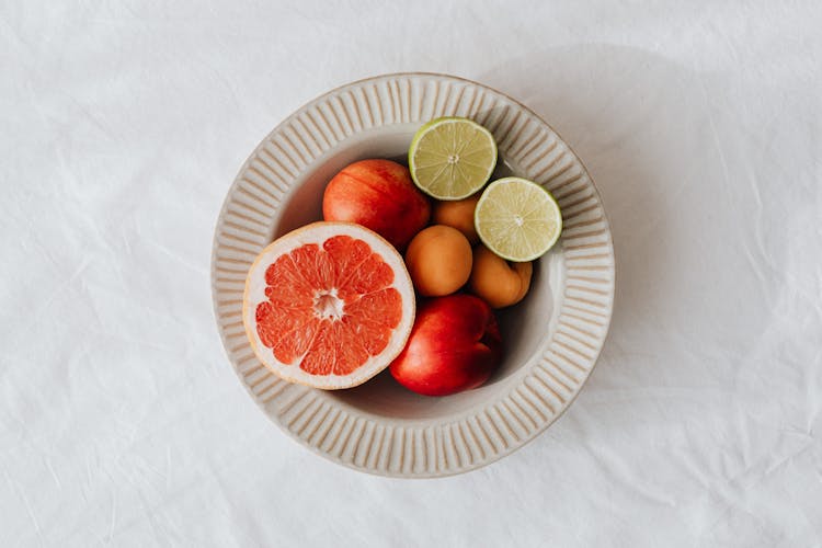 Plate Full Of Fruits On Table