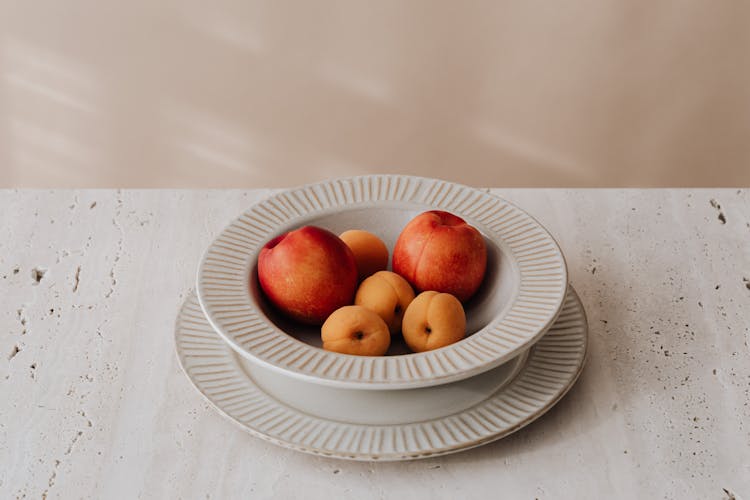 Apricots And Nectarines In White Deep Plate