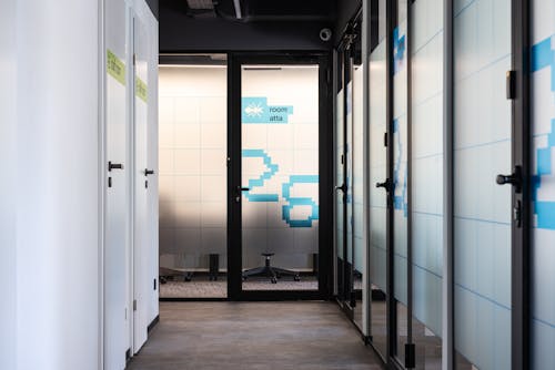 Free Empty corridor with doors in office center Stock Photo