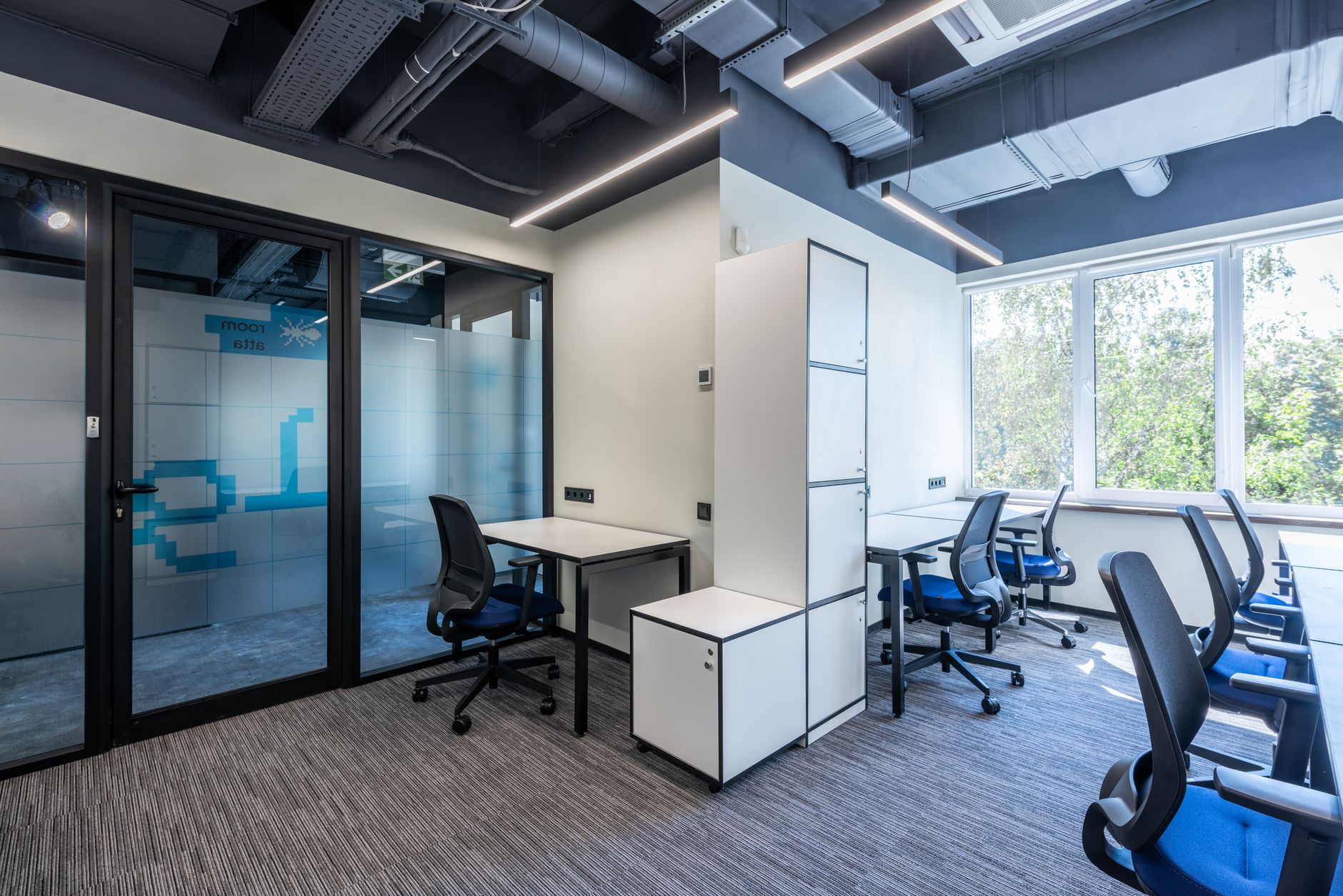 Commercial workspace with desks, chairs and hard flooring