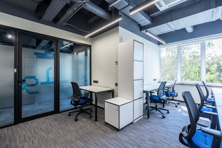 Modern Office With Chairs And Desks