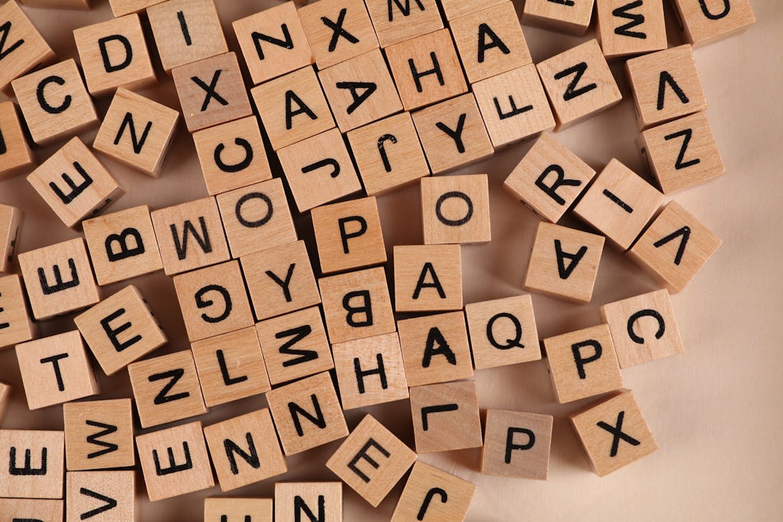 Close-Up Photo of Wooden Blocks with Letters · Free Stock Photo