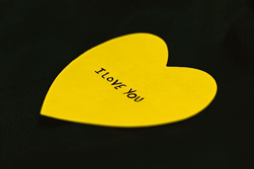Free Heart Shaped Paper Cutout with Texts Stock Photo