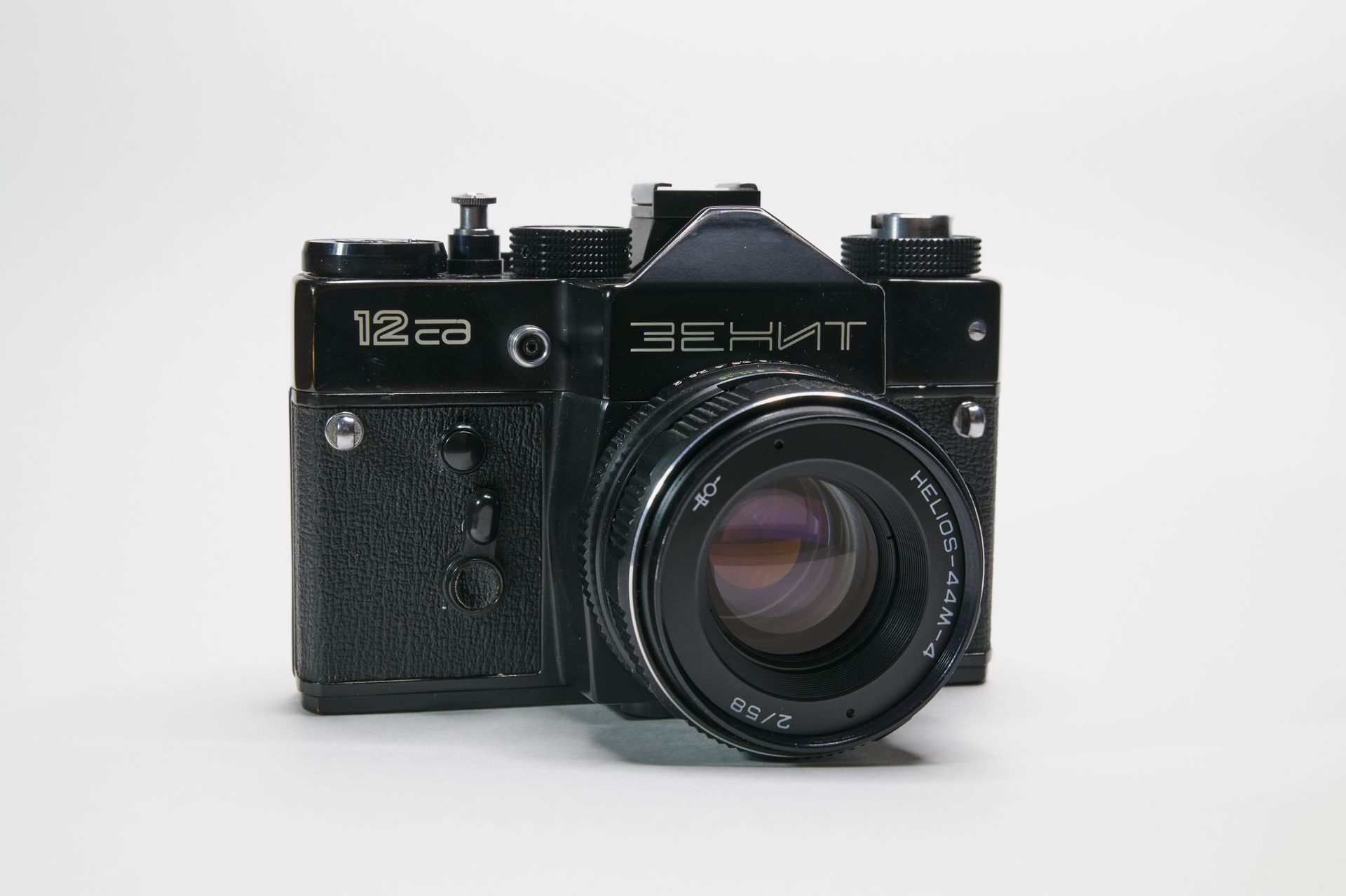 Classic Zenit camera featuring Helios lens against a clean white backdrop, perfect for photography enthusiasts and vintage collectors.