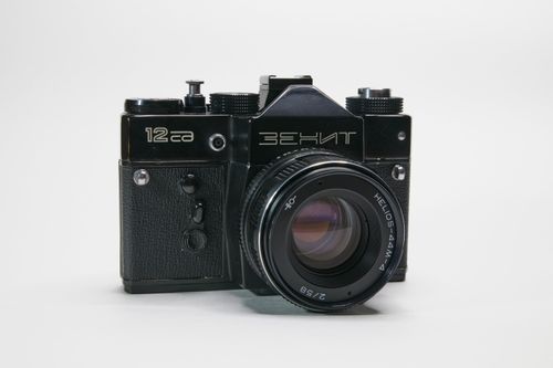 Free Classic Zenit camera featuring Helios lens against a clean white backdrop, perfect for photography enthusiasts and vintage collectors. Stock Photo