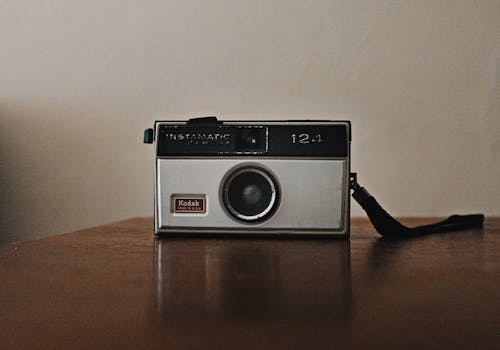 A Vintage Camera on a Wooden Table Top