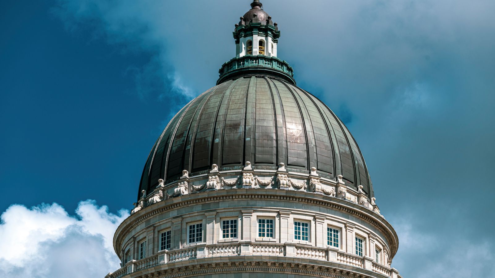 Close-up of the Utah State Capitol dome against a striking sky in Salt Lake City.