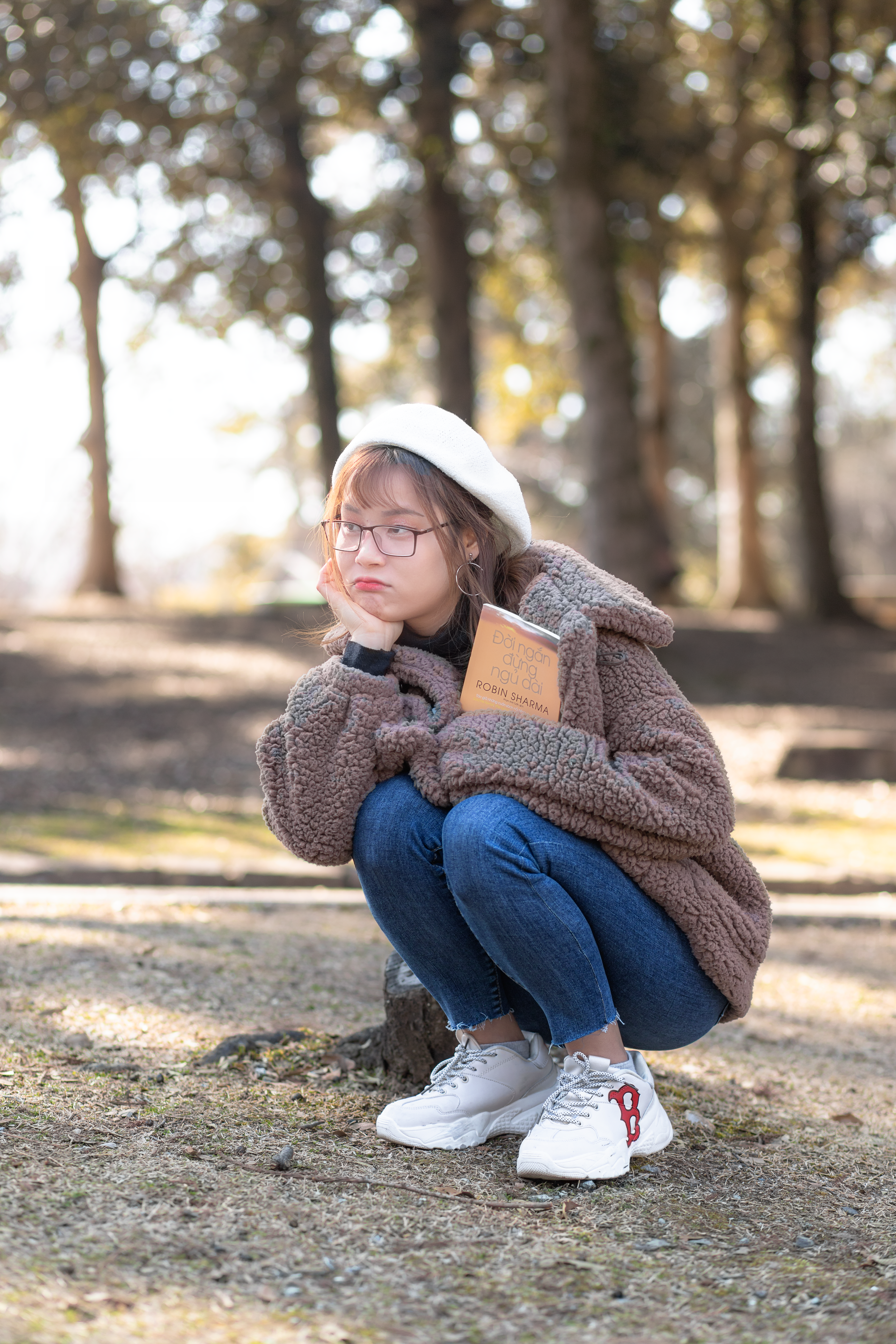 A Pretty Woman in Brown Fur Coat Sitting · Free Stock Photo