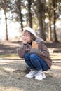 A Pretty Woman in Brown Fur Coat Sitting