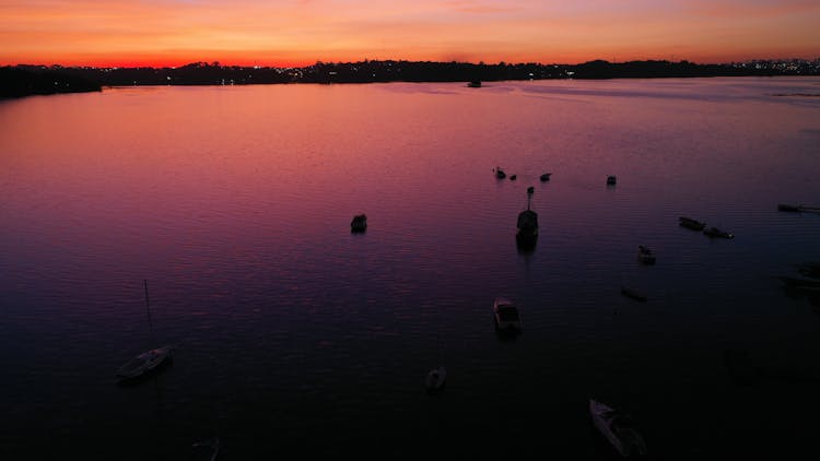 Silhouette Of Sailboats During Sunset