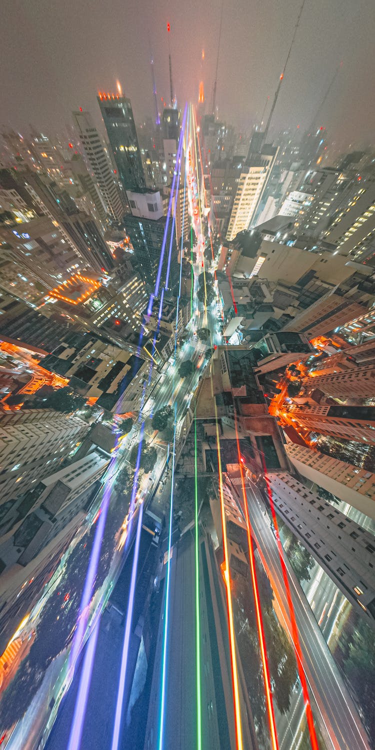 Light Trail In Illuminated Night City Panorama