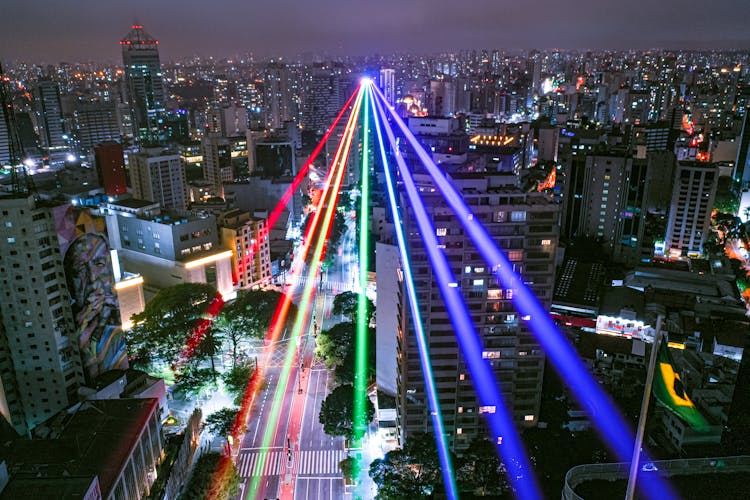 Rainbow Laser Lights Over The City At Night In Brazil 