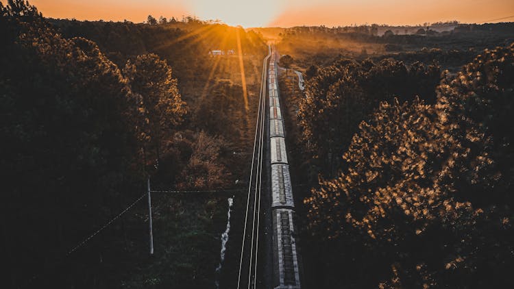 Sunset Over Train On Tracks