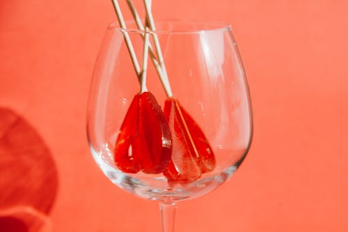 A Heart Shaped Lollipops Inside the Wine Glass