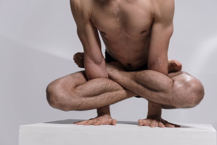 A Contortionist Lifting His Body Using His Hands