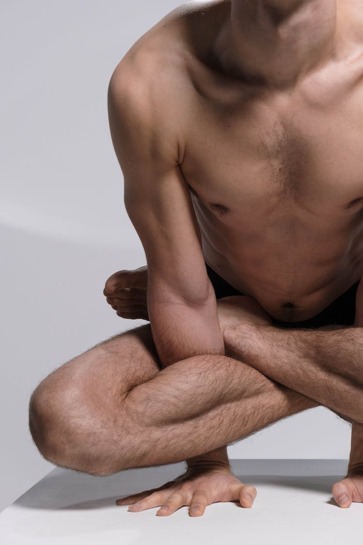 A Contortionist Lifting His Body Using His Hands