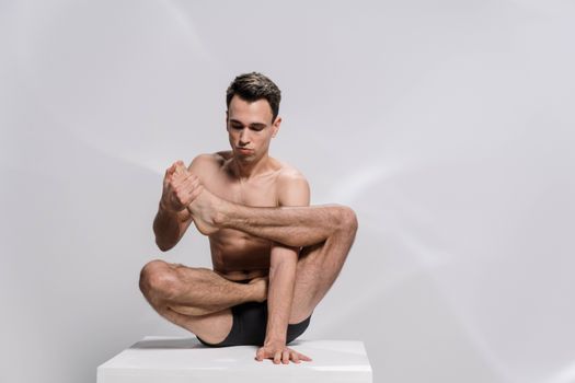 A Shirtless Man with a Flexible Body