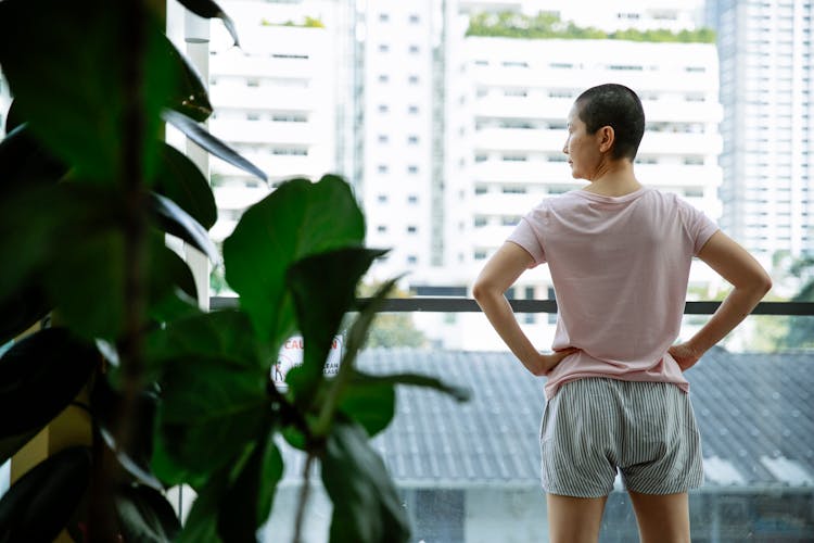 Short Haired Asian Woman Suffering From Cancer In Terrace Of Hospital