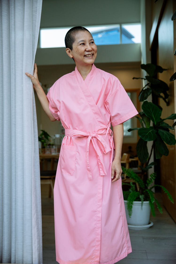 Positive Sick Asian Woman In Pink Robe In Hospital