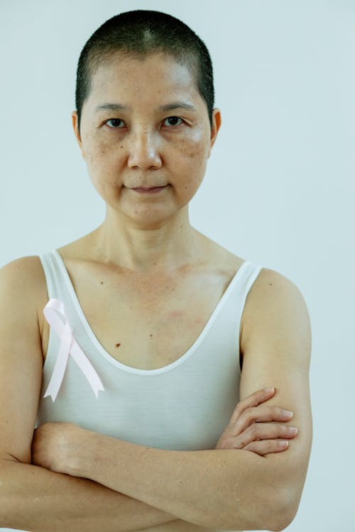 Confident Asian woman with folded arms