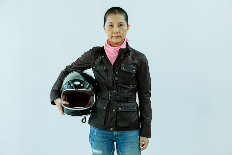 Asian Woman With Helmet In Hands