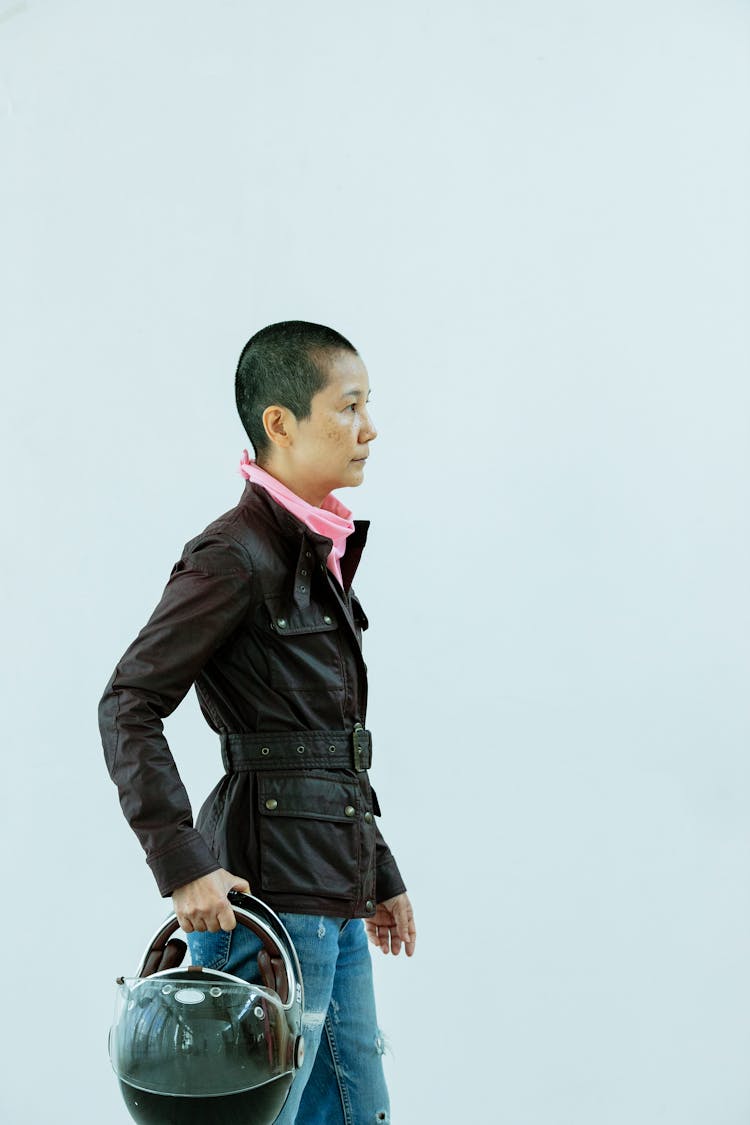 Asian Woman With Short Hair Standing With Motorcycle Helmet