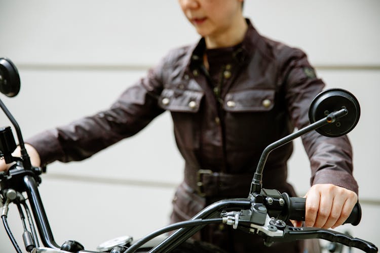 Anonymous Woman On Motorbike In Street