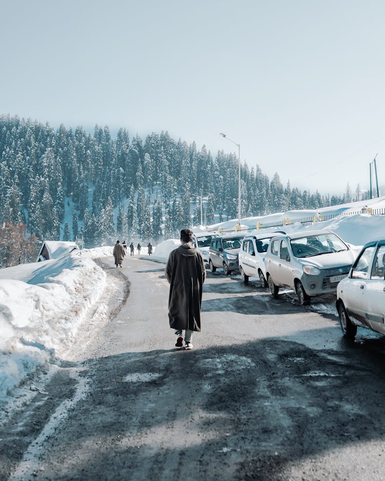 People Walking On The Road During Winter