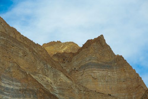 Free Capture of rugged rocky mountains against a vibrant blue sky, showcasing natural beauty. Stock Photo