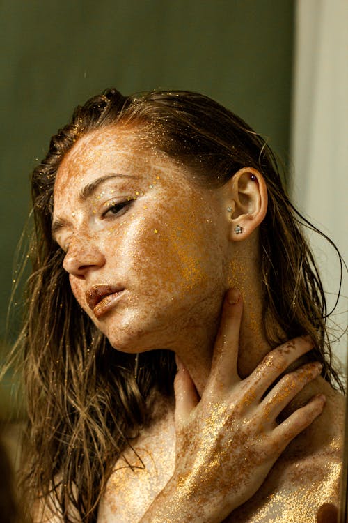 Free A Woman with Gold Glitters on Her Face Stock Photo