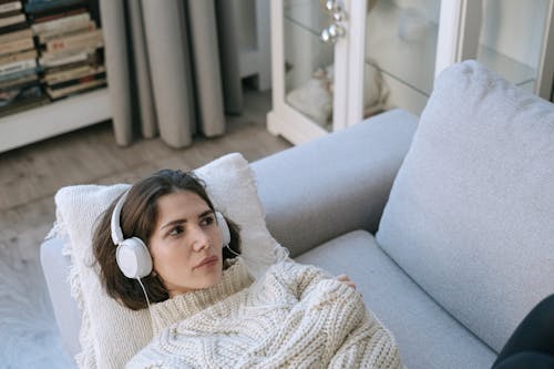 Free A Woman Lying on the Couch Stock Photo