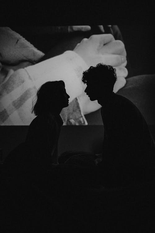 Silhouette of Woman and Man Kissing