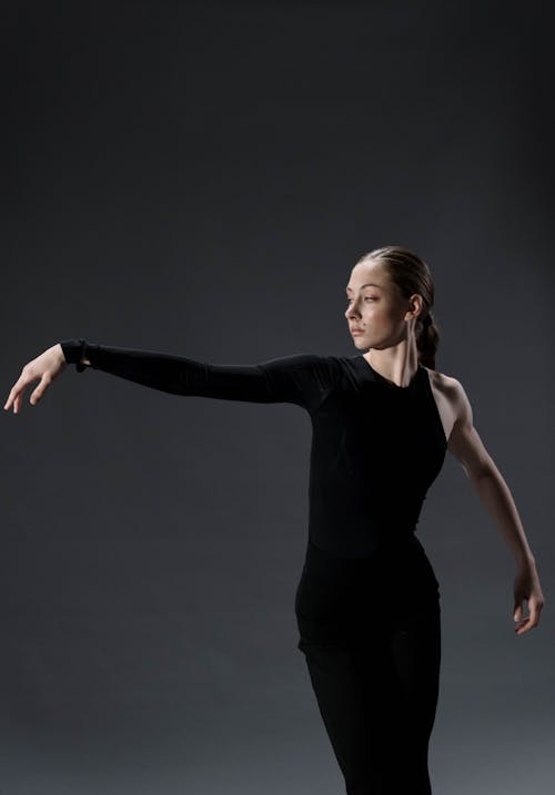 Woman in Black Tank Top and Black Pants