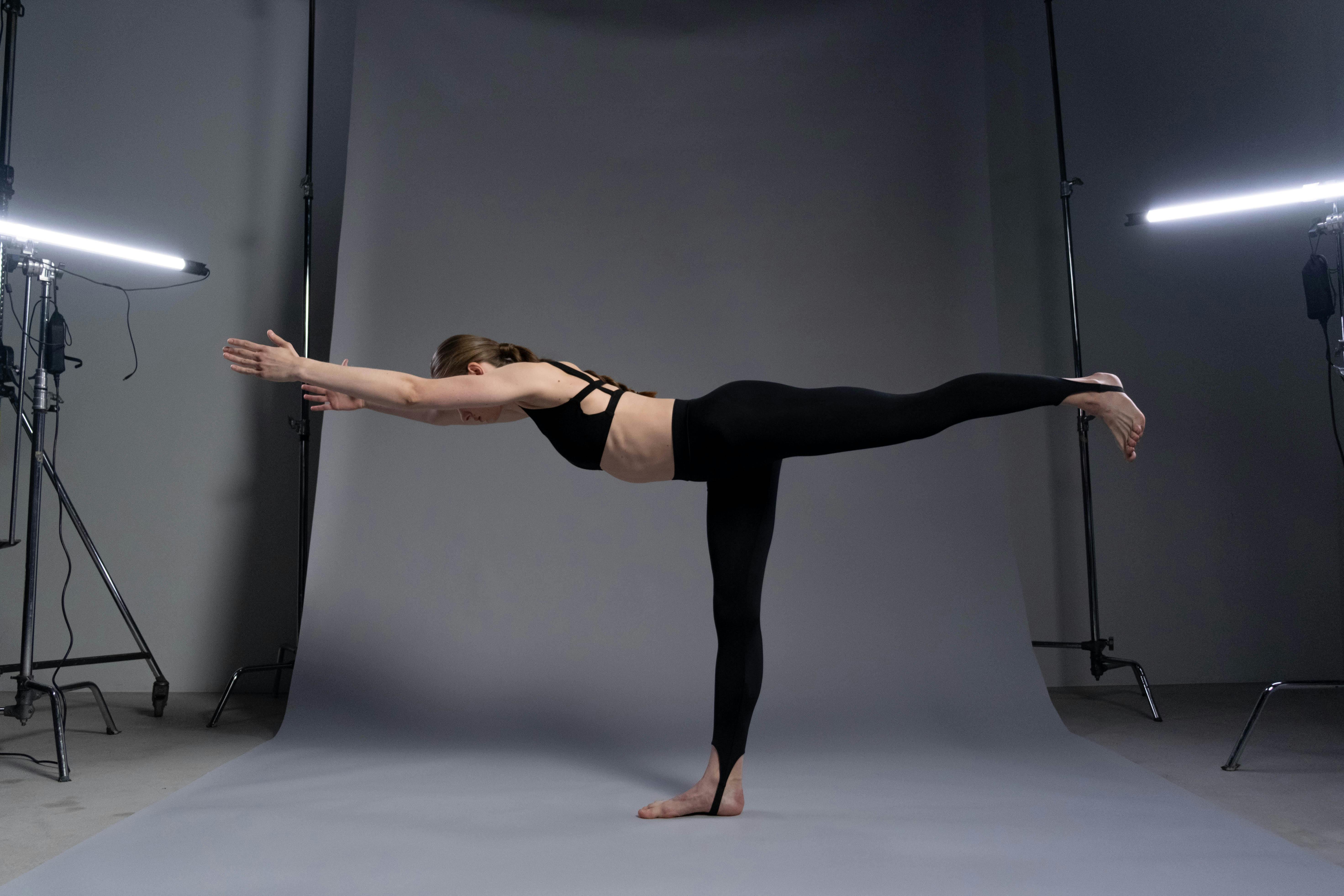 Woman Performs A One-Legged Standing Pose