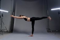 Woman Standing with One Leg