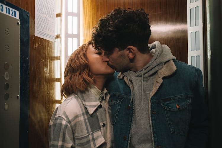 A Couple Kissing In The Elevator