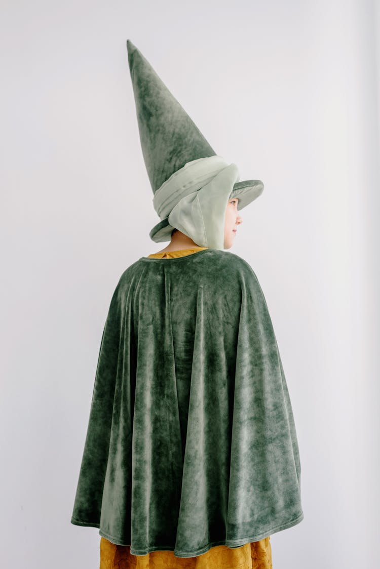 Young Girl Wearing Green Fairy Hat And Cape
