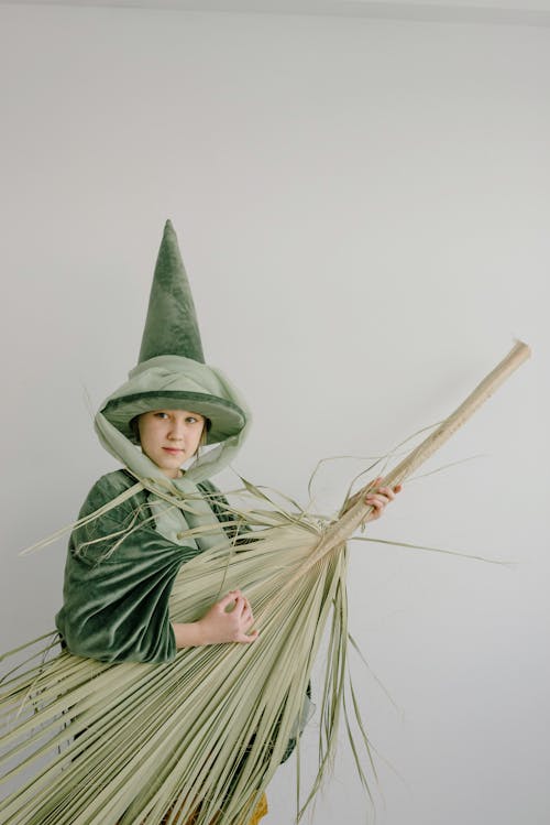Girl Wearing Fairy Costume Holding a Palm Leaf