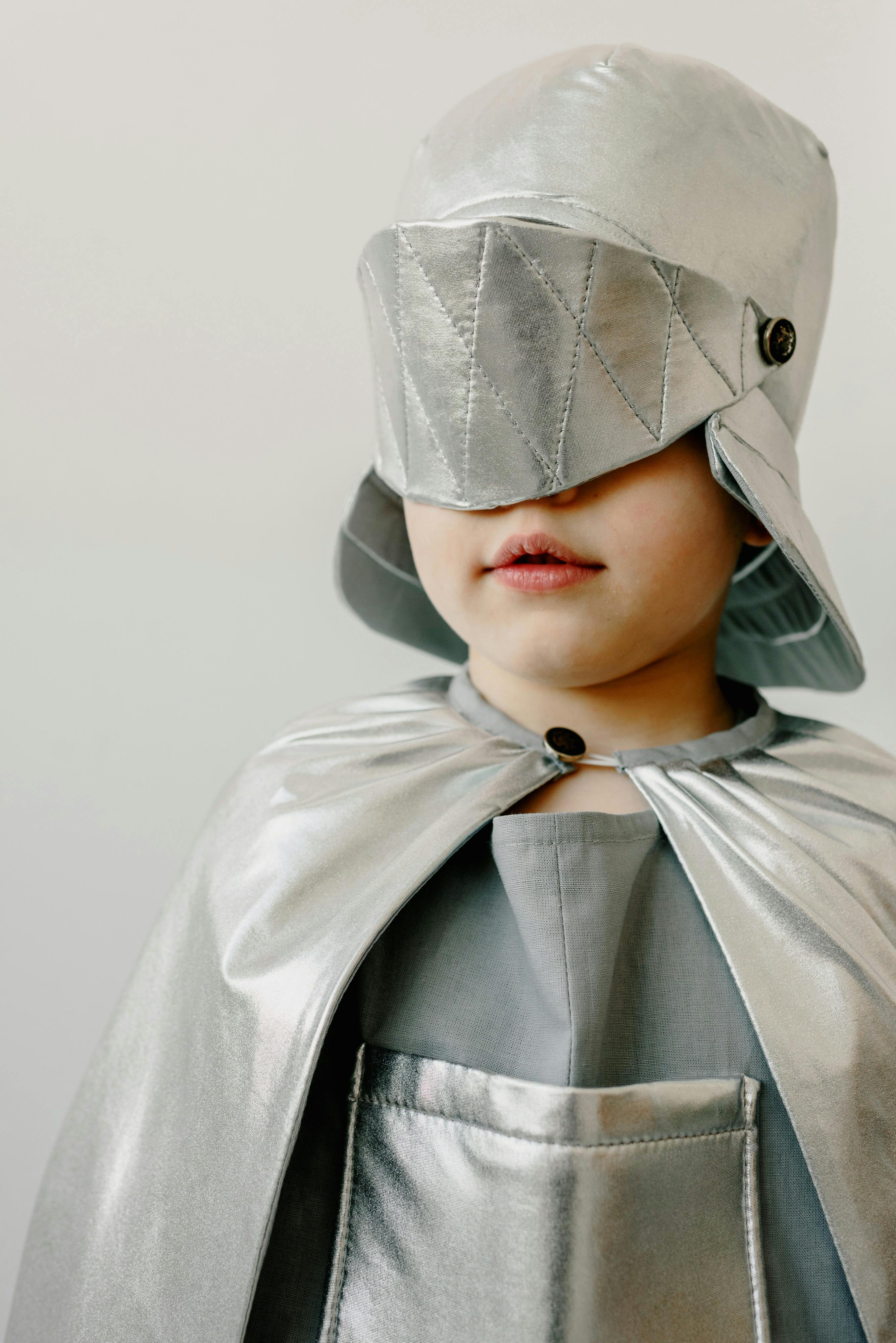child wearing a silver costume