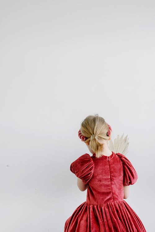 A Young Girl Wearing Red Dress