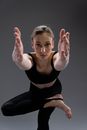 Woman in Black Tank Top and Black Leggings Doing Yoga