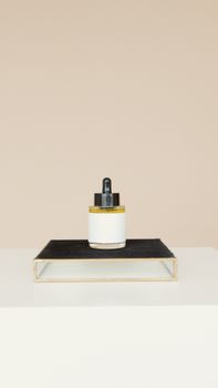 Elegant skincare product on a black stand against a neutral background.